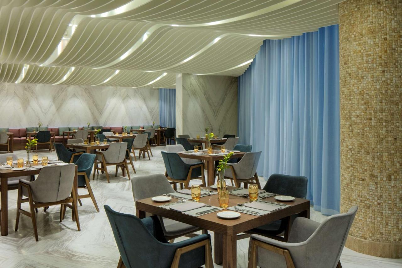 Radisson Blu Hotel Apartment Dubai Silicon Oasis מראה חיצוני תמונה
